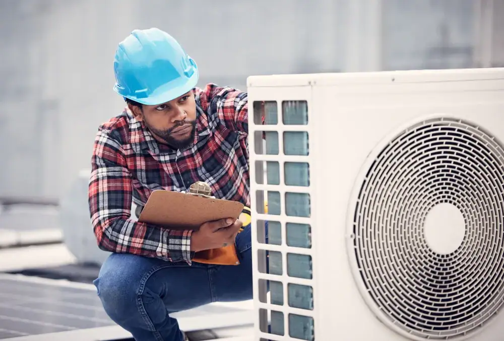 Electrician Inspecting Air Conditioner Greater Bridgeport Planning Region Connecticut_1