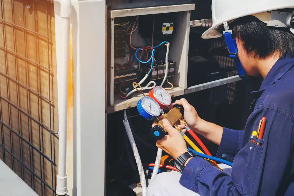 Technician Inspecting Ac Unit Greater Bridgeport Planning Region Connecticut_1