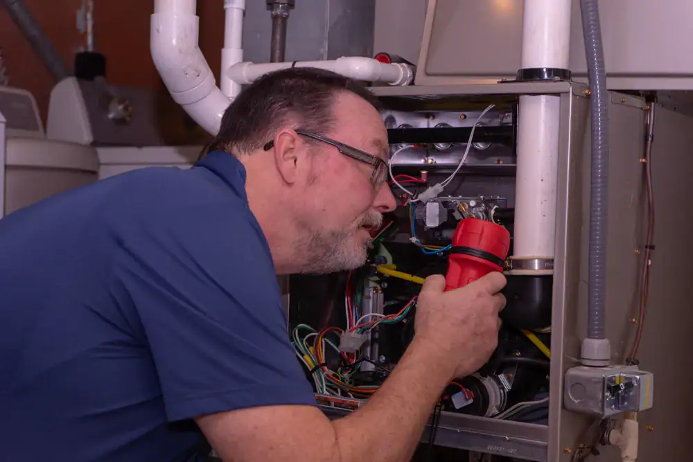 Technician Inspecting Furnace Greater Bridgeport Planning Region Connecticut
