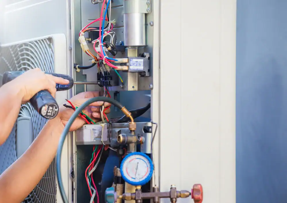 Technician Repairing Air Conditioner Greater Bridgeport Planning Region Connecticut_1